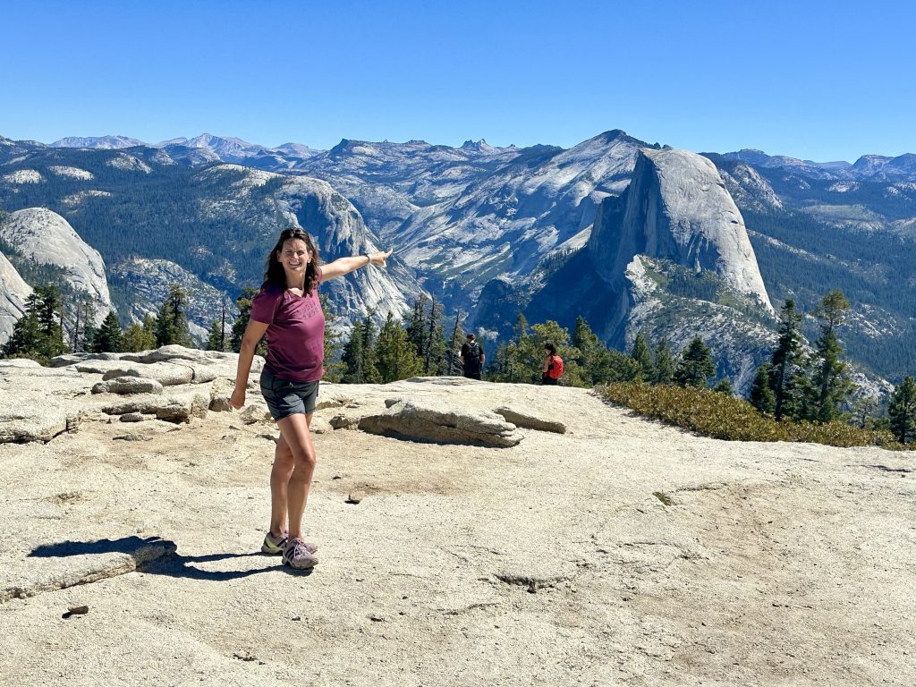 Pointing to Half Dome from the top of Sentinel Dome Hike in Yosemite National Park, near Taft Point