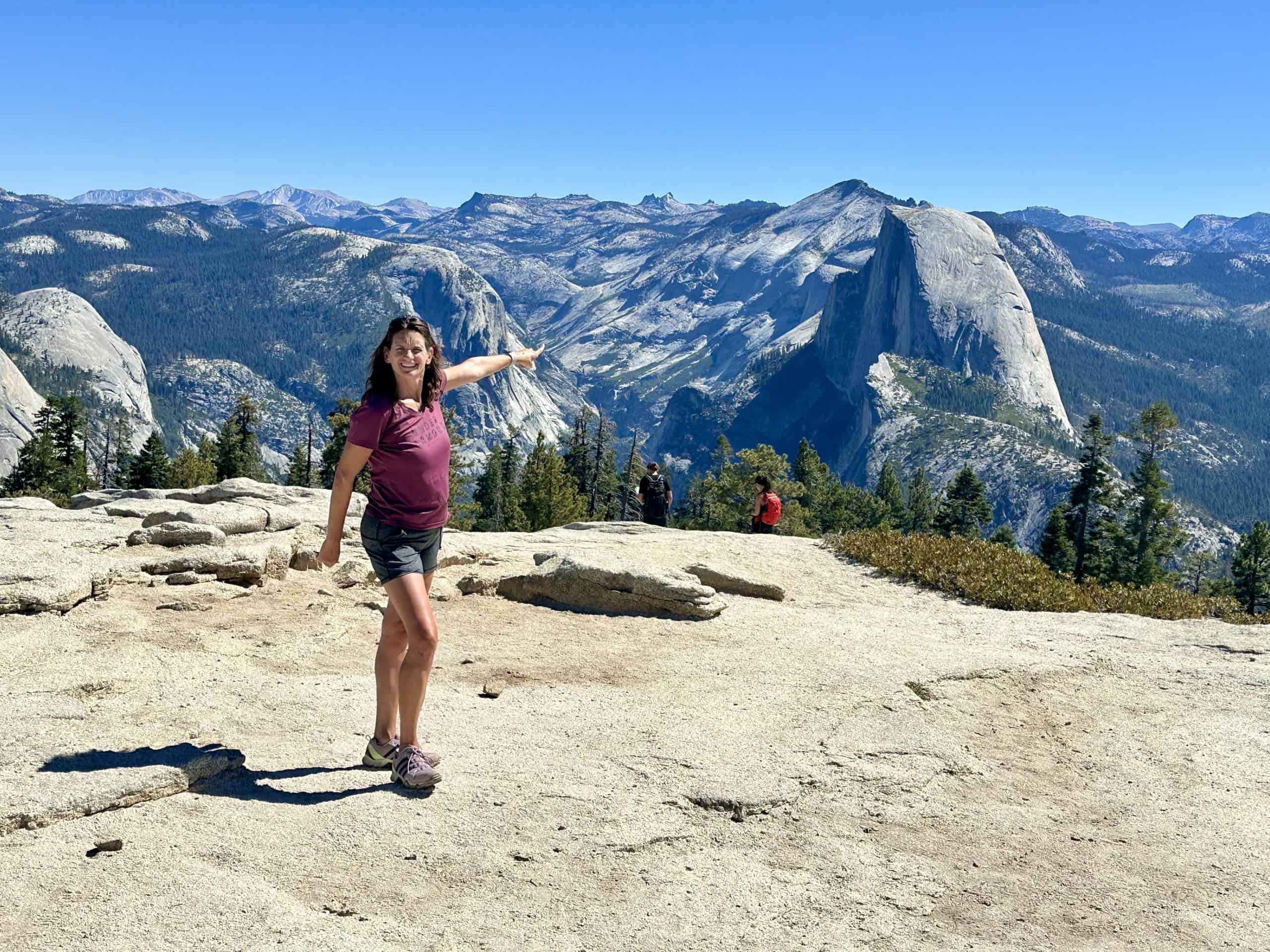Pointing to Half Dome from the top of Sentinel Dome Hike in Yosemite National Park, near Taft Point