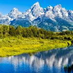 Stunning Grand Tetons mountains reflecting in Jenny Lake at Grand Teton National Park