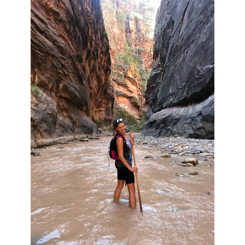 Hiking the Narrows in Zion National park, part of the Big 5 National Parks in Utah