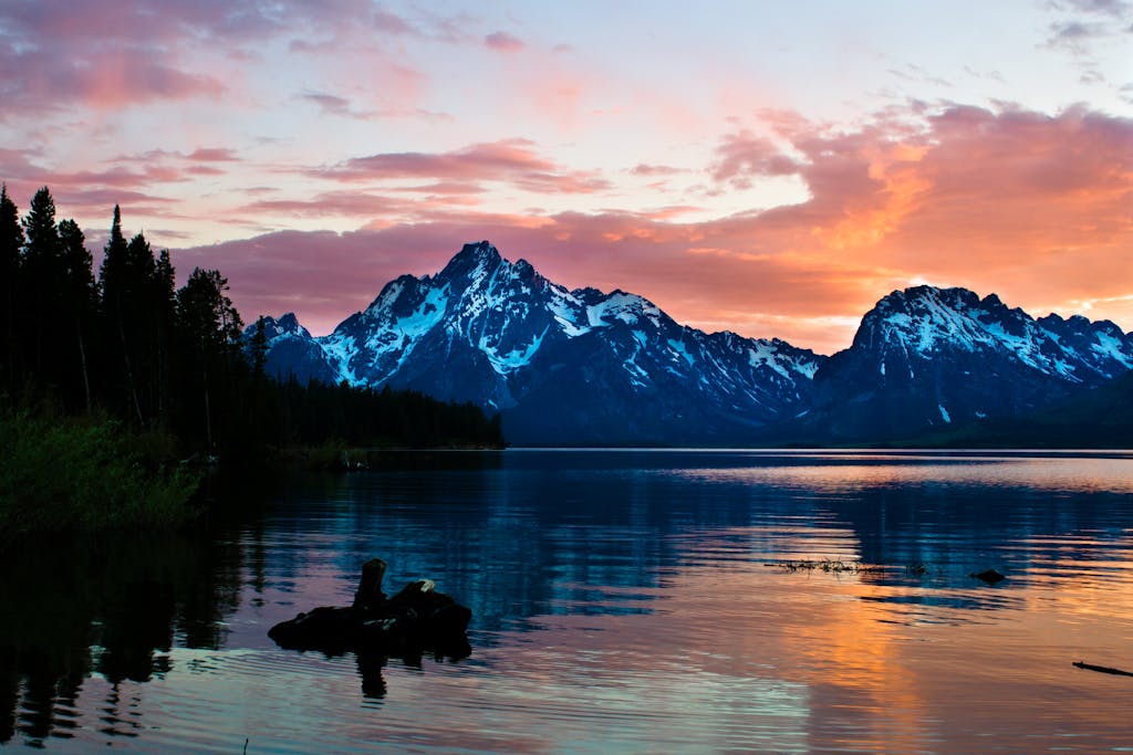 Short, easy hike to see breathtaking sunrise over Jenny Lake with snow-capped mountains at Grand Teton National Park