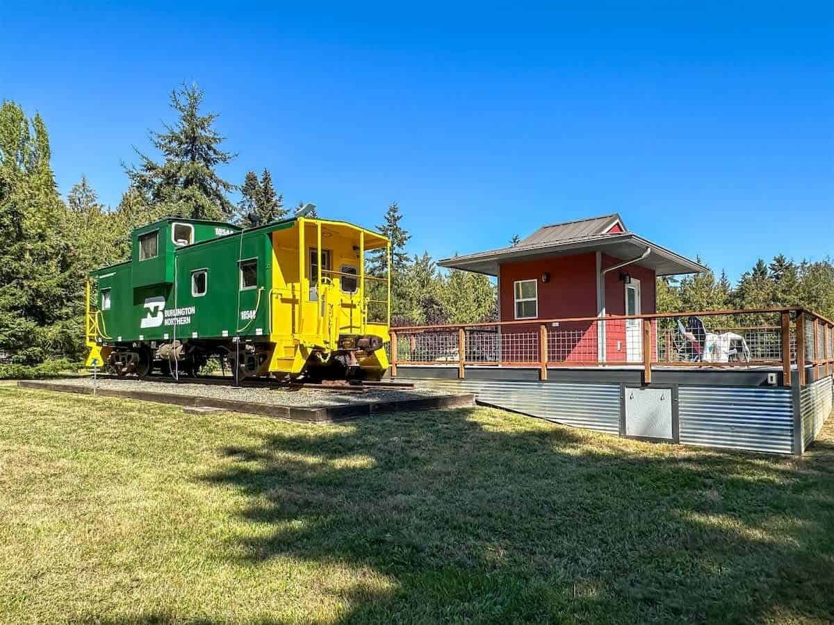 A renovated 1926 railroad caboose with an exterior depot that is now a lodging option close to Olympic National Park