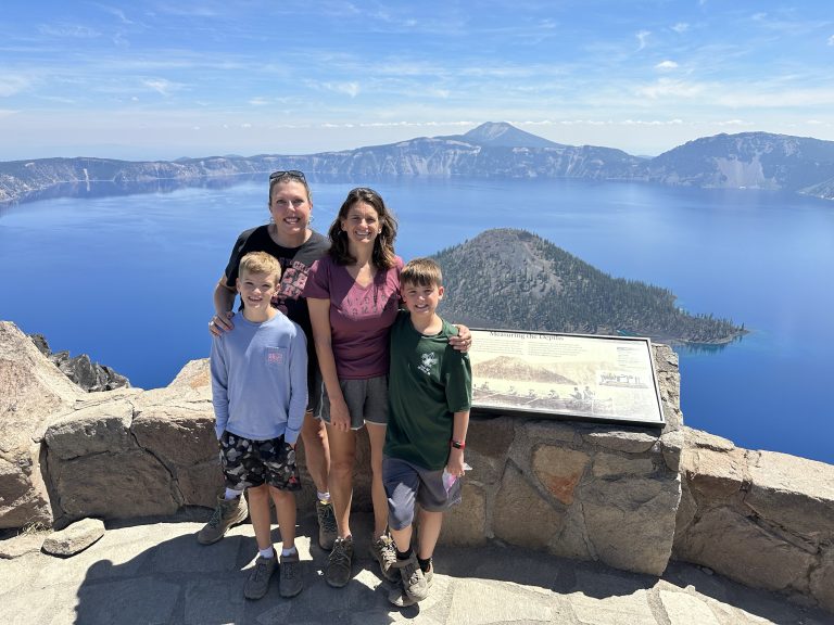 Family overlooking Wizard Island at Crater Lake National Park