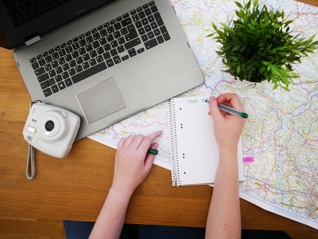 Woman at computer contemplating, Do I need a travel planner?  or should I do it myself