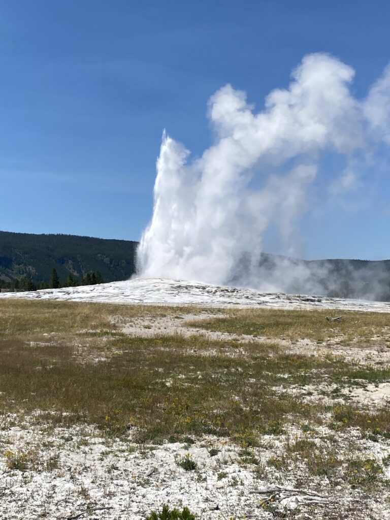 Old Faithful erupting at Yellowstone National Park