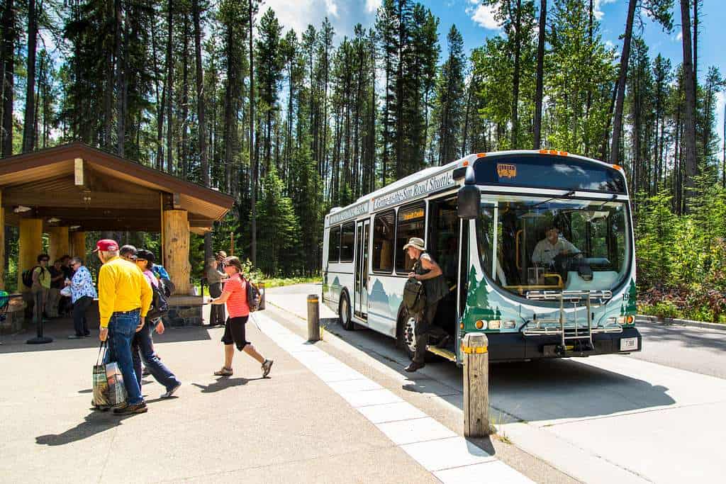 People getting off the Glacier National Park Shuttle on the Going-to-the-Sun Road