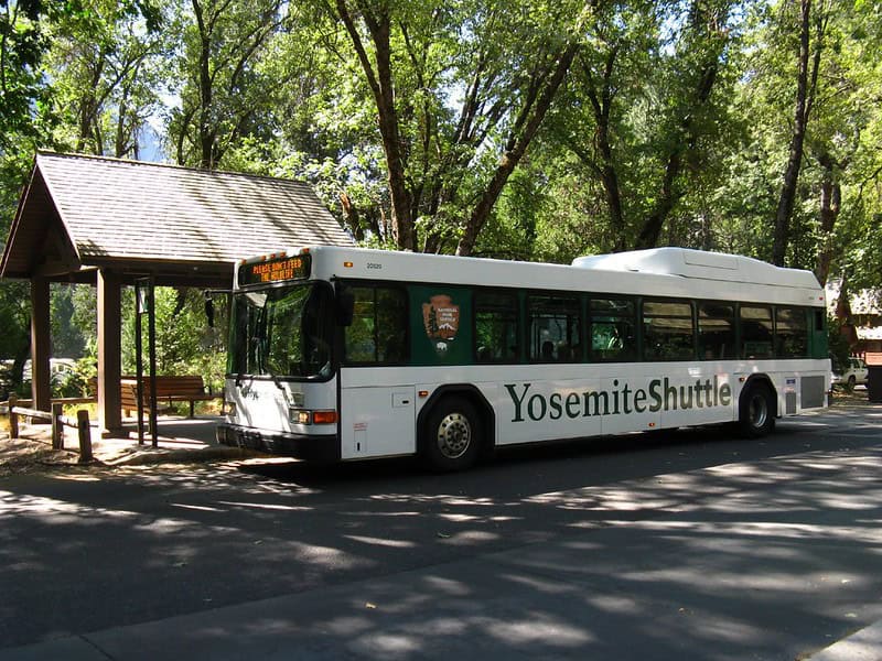 Yosemite National Park Shuttle at a bus stop in Yosemite Valley