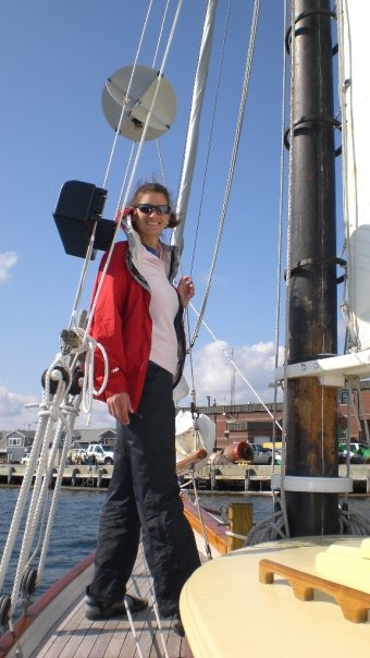 Woman standing on sail boat on Sailing trip around Acadia National Park