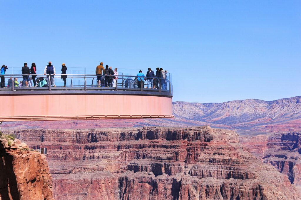 People walking on a glass overhang at the Grand Canyon Skywalk on the West Rim of Grand Canyon National Park