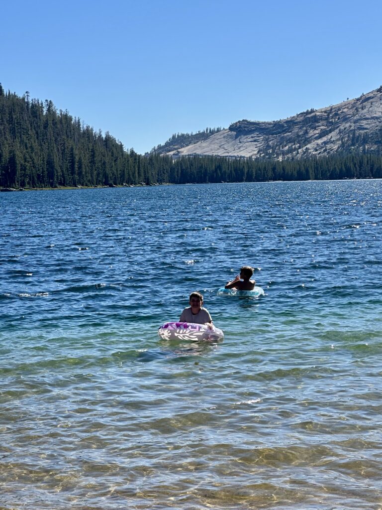 Swimming and floating in Tenaya Lake on Tioga Road in Yosemite National Park