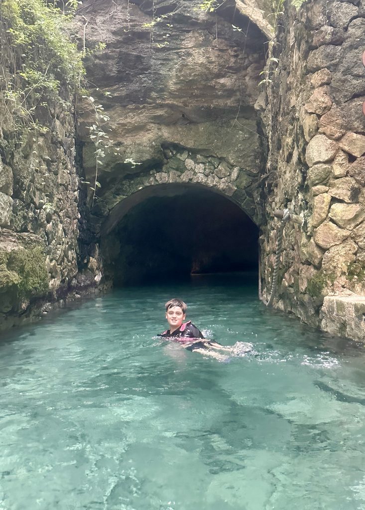 Swimming in underground rivers in Xcaret park at Playa del Carmen