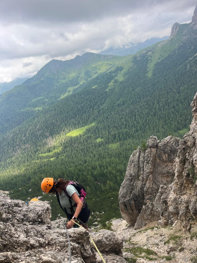 Climber on the via ferrata "iron rungs of the Italian Dolomites